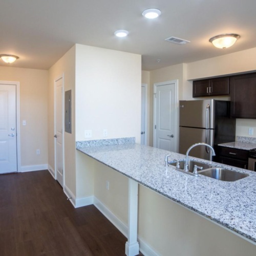a kitchen with black appliances