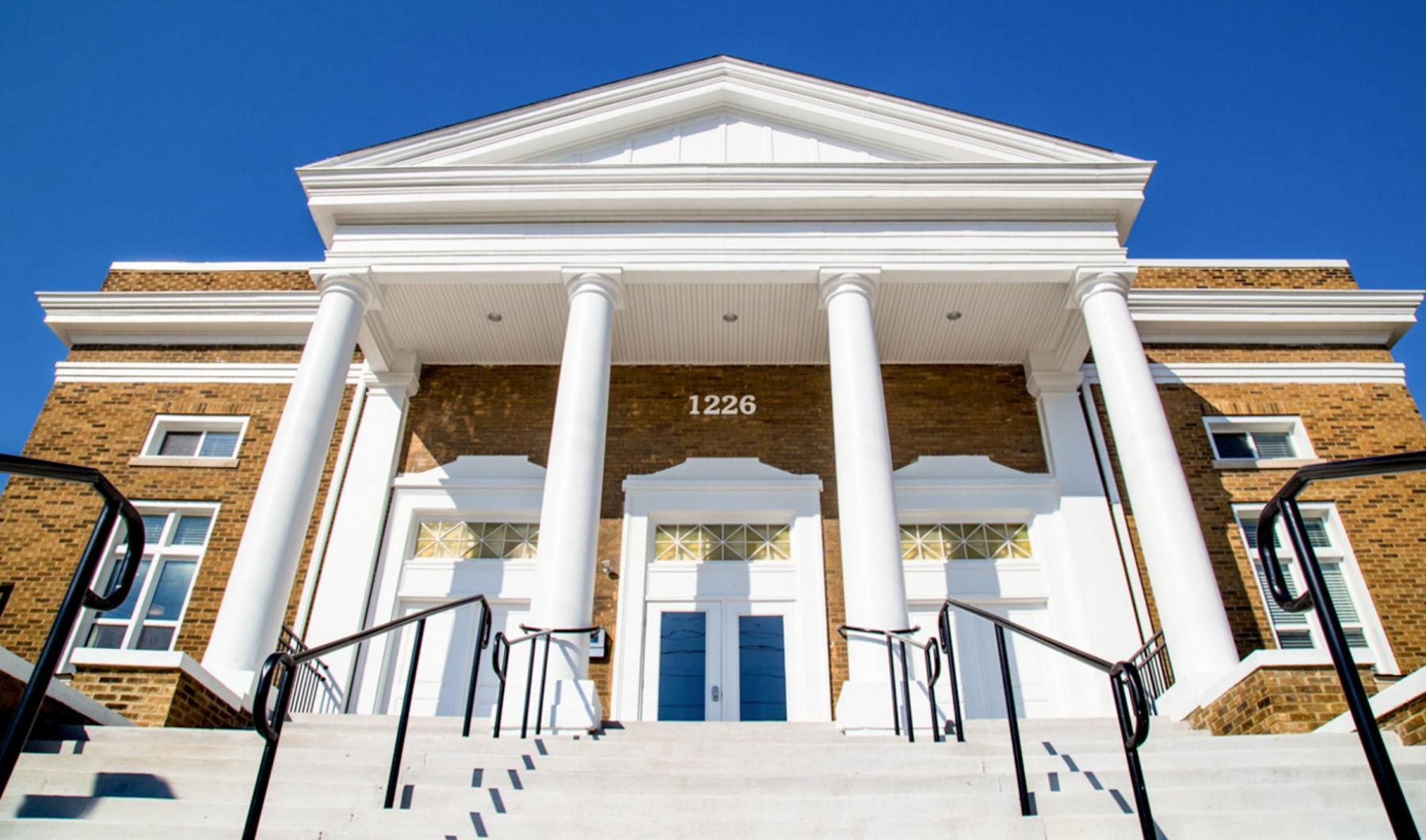 a building with columns and a staircase